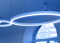 Ceiling with round modern LED lamps. Suspended fluorescent lights under the ceiling. Careful energy consumption, energy saving concept Lighting