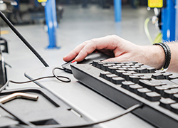 Automotive Technician Checking Vehicle Database Documentation Vehicle Repair